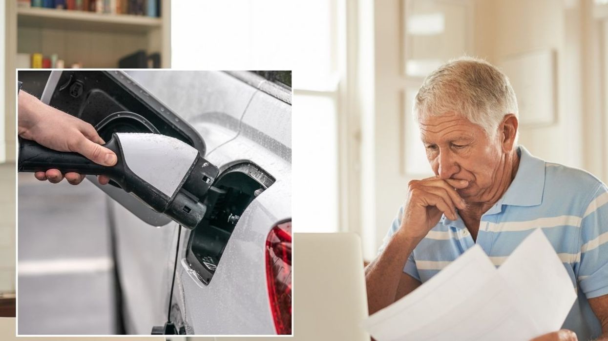 Electric car charging and a concerned man looking for car insurance quotes