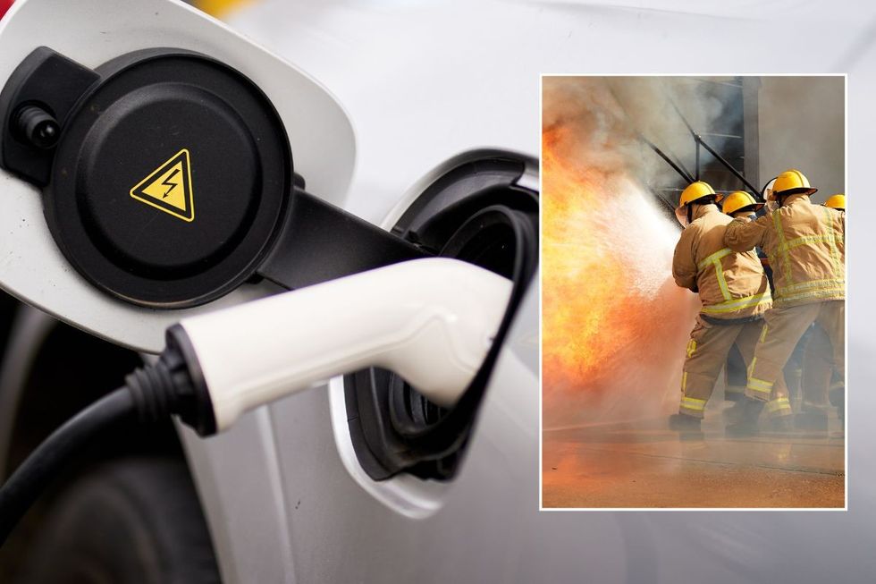 Electric car charging and firefighters putting out a fire