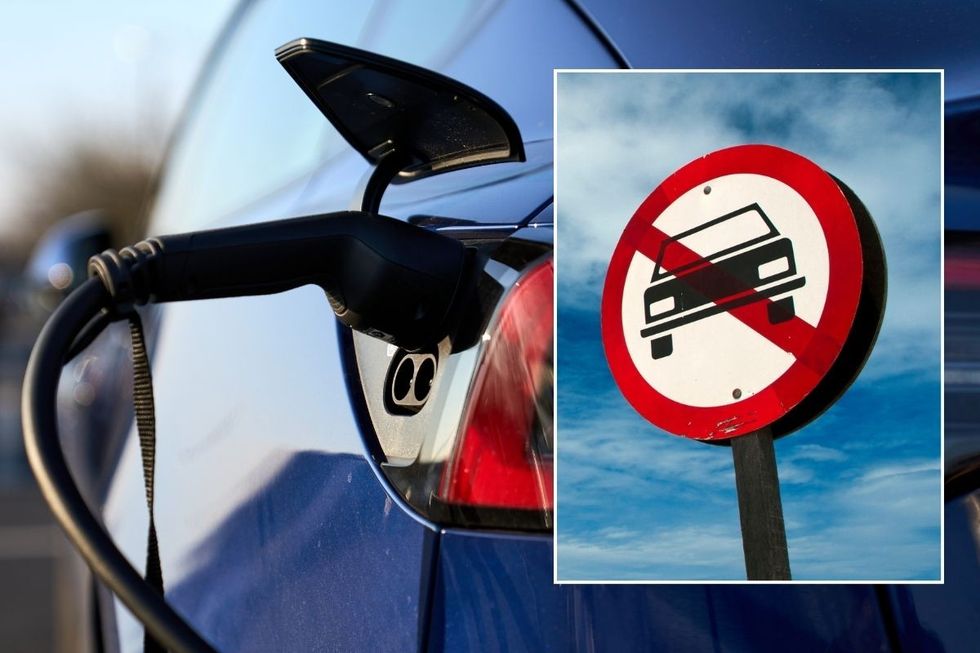 Electric vehicle charging and a car ban sign