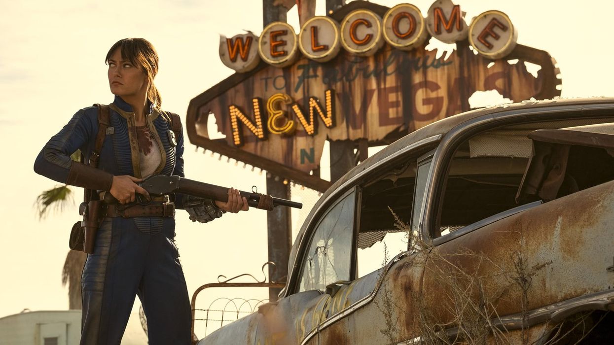 Ella Purnell pictured outside the Welcome To New Vegas sign from Fallout season 2