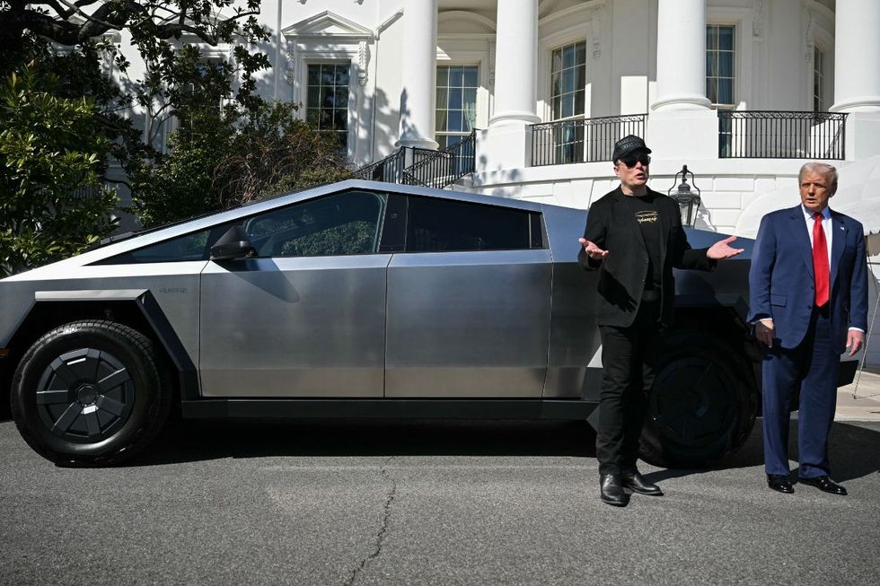 Elon Musk and President Donald Trump with a Tesla Cybertruck outside the White House