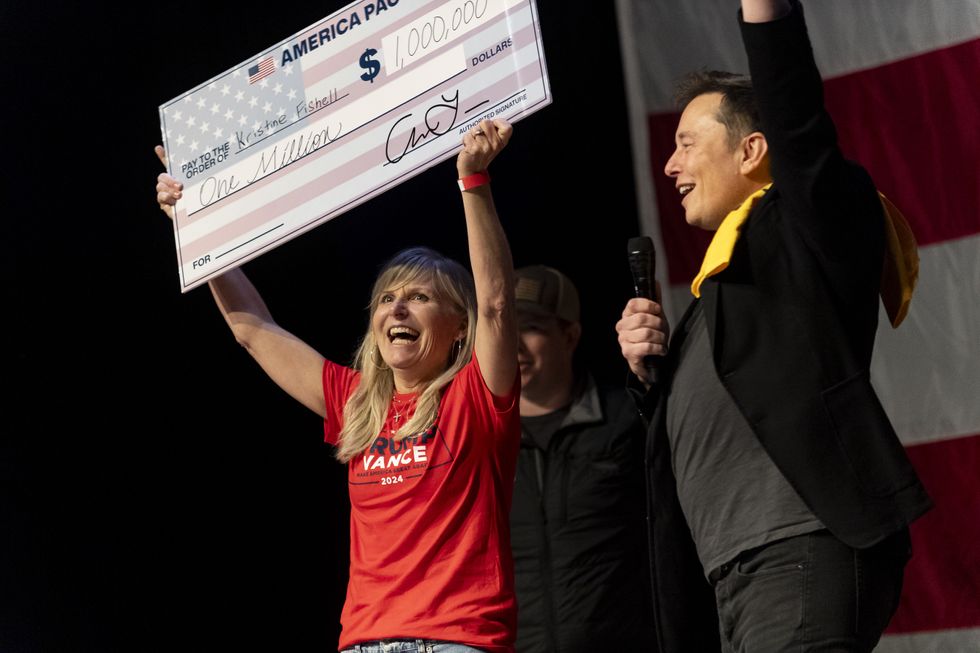 Elon Musk awarded Kristine Fishell with a $1 million check during the town hall at the Roxain Theater on October 20
