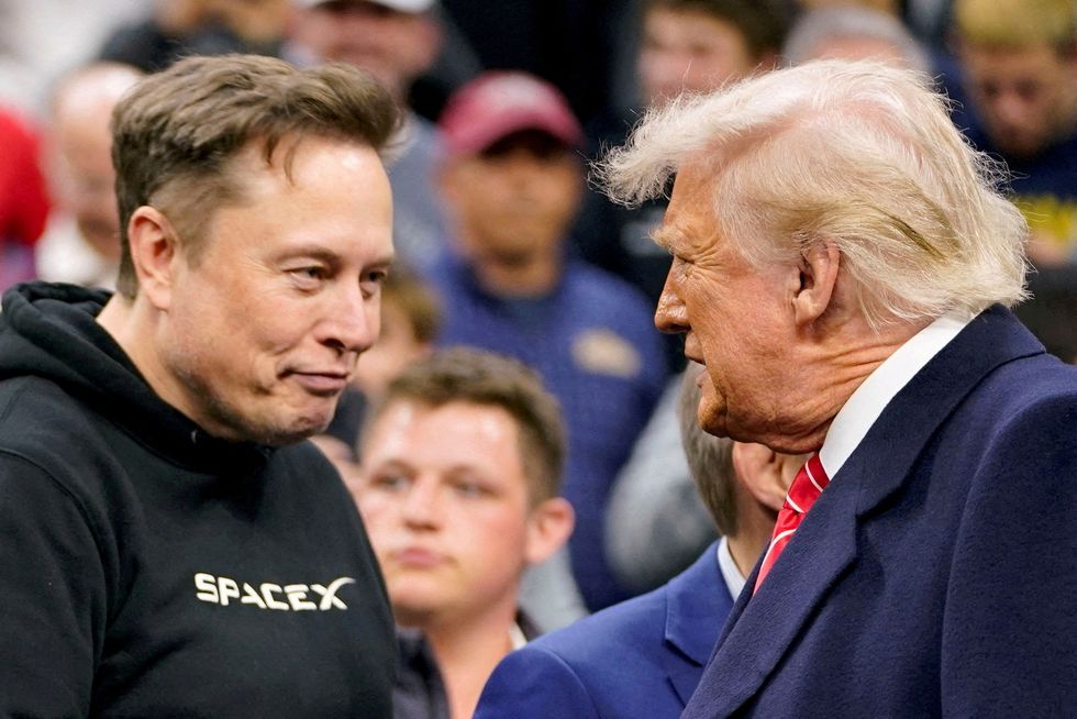 Elon Musk greets U.S. President Donald Trump as they attend the NCAA men's wrestling championships in Philadelphia\u200b