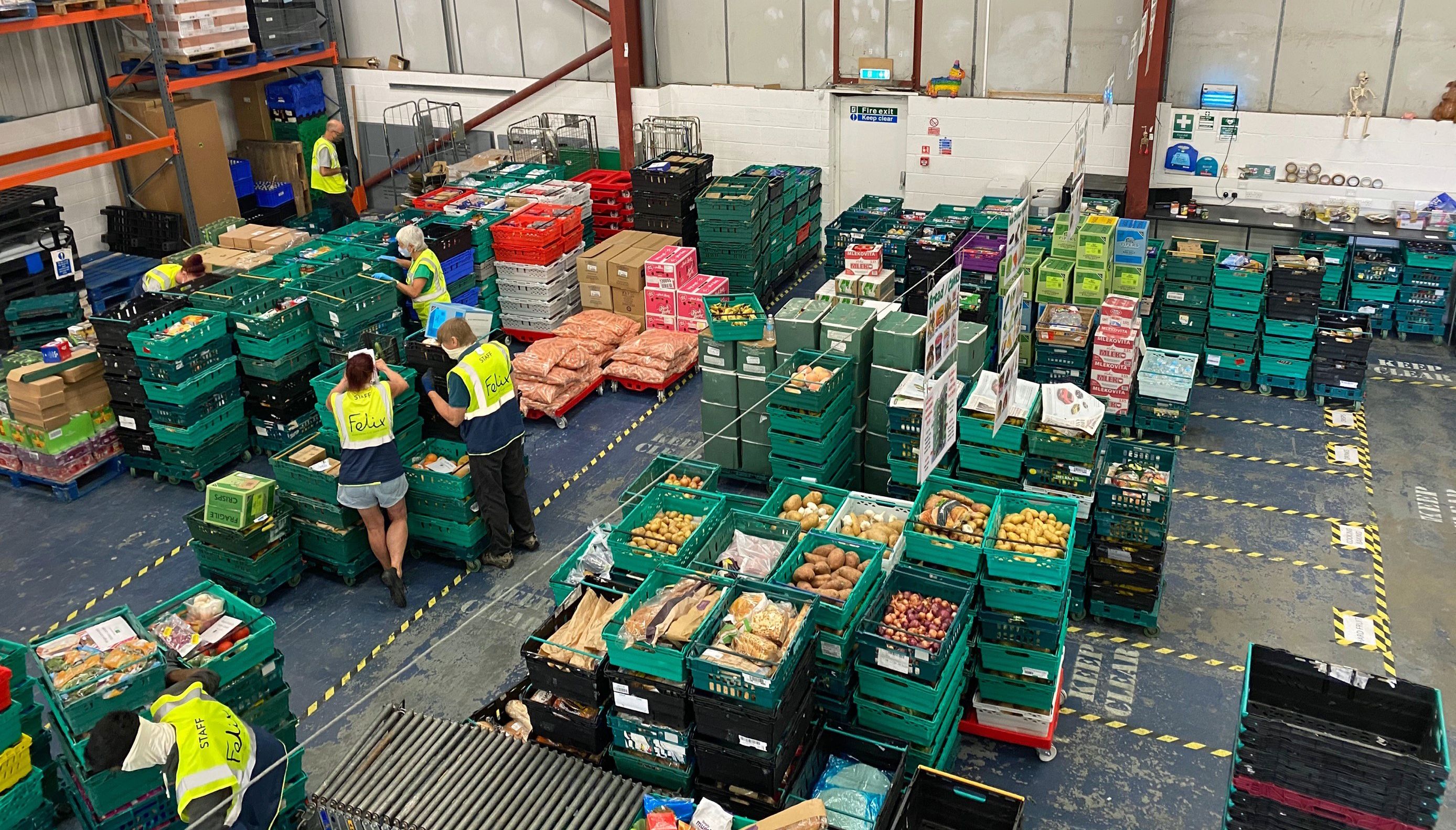 EMBARGOED TO 0001 FRIDAY DECEMBER 2 Undated handout photo issued by The Felix Project of workers putting together food donations at one of their units. Funds donated by the King will help hundreds of food banks and community groups across the UK to store more food by providing them with fridges and freezers. The white goods will be distributed to local charities, food banks and social pantries identified by the Felix Project in London and across the UK by The Trussell Trust, FareShare and British Asian Trust. Issue date: Friday December 2, 2022.