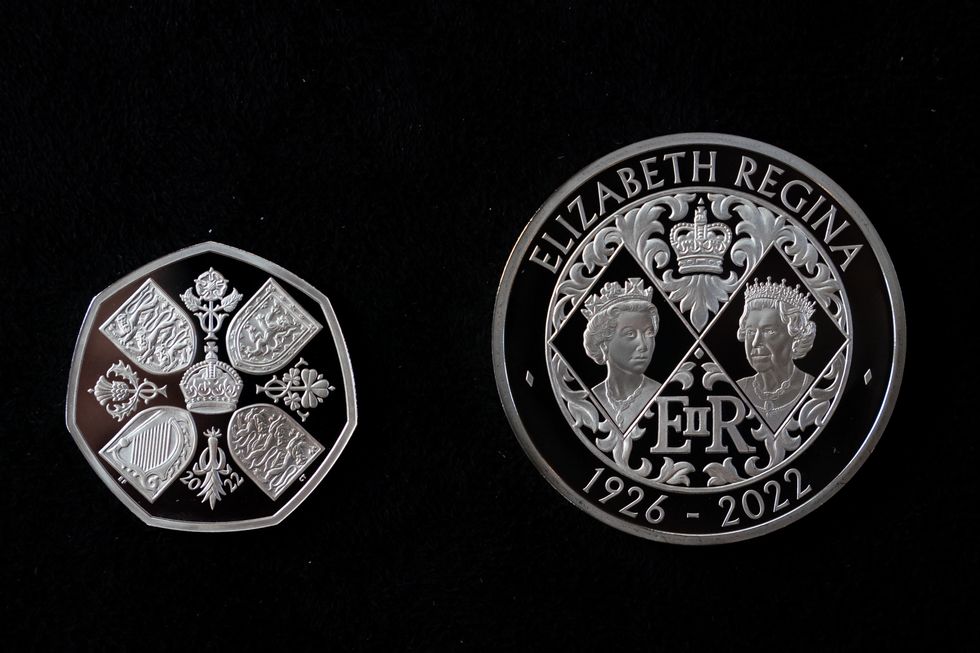 EMBARGOED TO 0001 FRIDAY SEPTEMBER 30 A 50 pence and 5 Crown commemorating the life and legacy of Queen Elizabeth II, during an announcement regarding the designs for the new coins and notes depicting King Charles III at the Worshipful Company Of Cutlers, at Cutlers' Hall, London. Picture date: Thursday September 29, 2022.