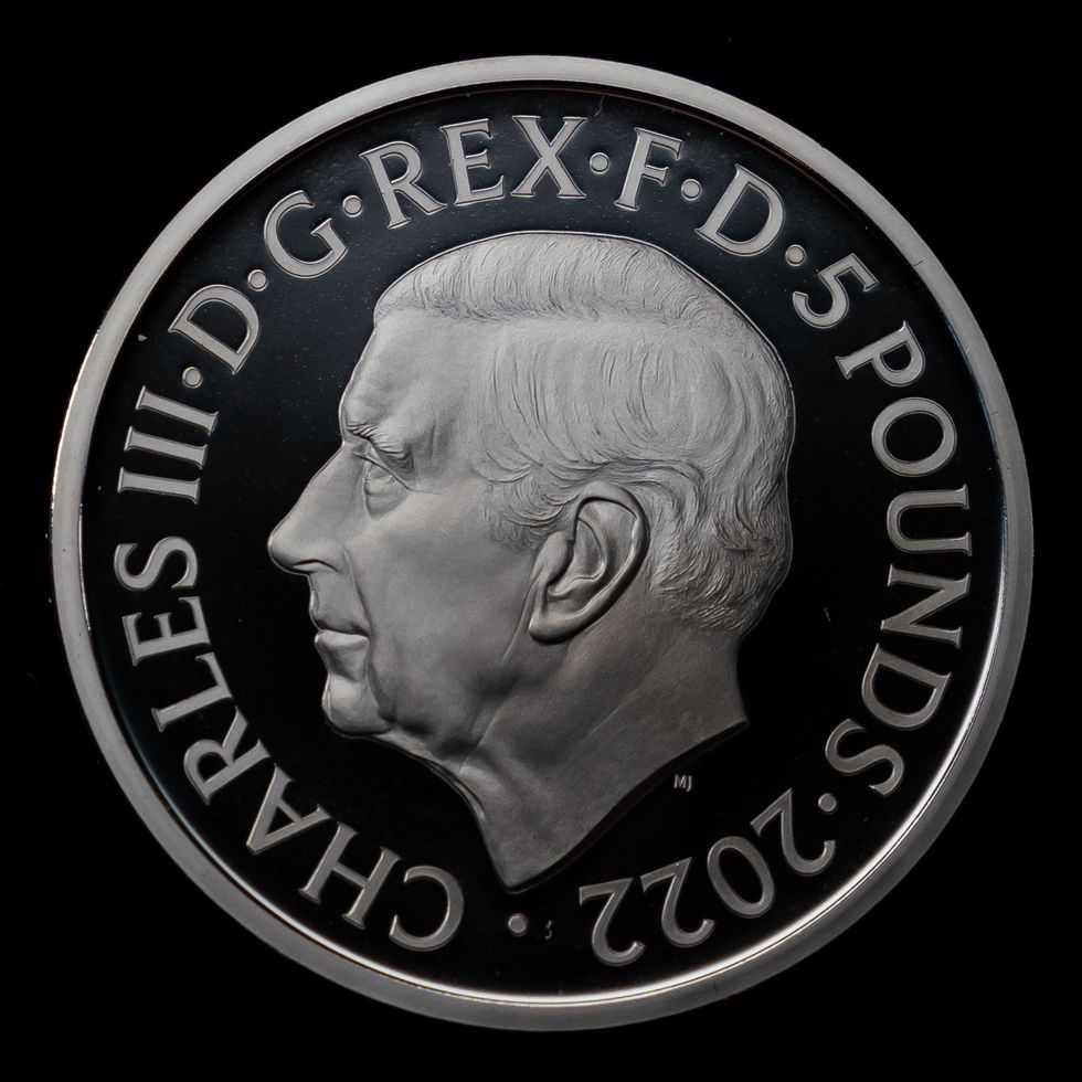 EMBARGOED TO 0001 FRIDAY SEPTEMBER 30 The official coin effigy of King Charles III on a 5 Crown commemorating the life and legacy of Queen Elizabeth II, during an announcement regarding the designs for the new coins and notes depicting King Charles III at the Worshipful Company Of Cutlers, at Cutlers' Hall, London. Picture date: Thursday September 29, 2022.