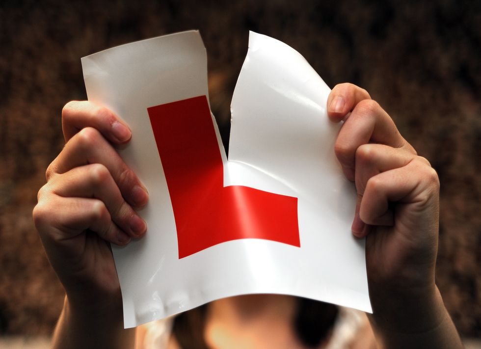 Embargoed to 0001 Monday December 13 File photo dated 28/07/09 of a person ripping up a learner plate. More than half a million learner drivers are waiting to take their test amid a huge backlog, figures reveal. Issue date: Monday December 13, 2021.