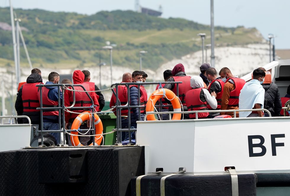 EMBARGOED TO 0001 MONDAY JULY 18 File photo dated 14/07/22 of a group of people thought to be migrants are brought in to Dover, Kent, following a small boat incident in the Channel, as there is %22no clear evidence%22 the Government's plan to send migrants to Rwanda will deter Channel crossings, according to MPs.