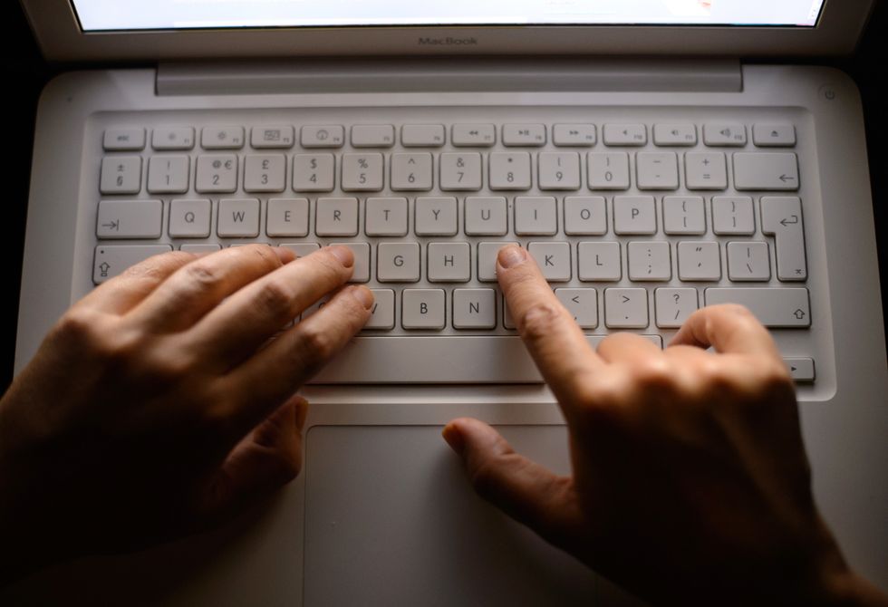 EMBARGOED TO 0001 MONDAY JUNE 27 File photo dated 06/08/2013 of someone using a laptop keyboard. Scots have been warned to be vigilant as online scammers prepare to target millions of people, according to a report by police, security and banking experts. Fraudsters are focusing on holidays, tickets for major sporting and music events and unsolicited emails to catch out unsuspecting web users, according to Police Scotland, the Scottish Business Resilience Centre (SBRC) and the Royal Bank of Scotland. Issue date: Monday June 27, 2022.