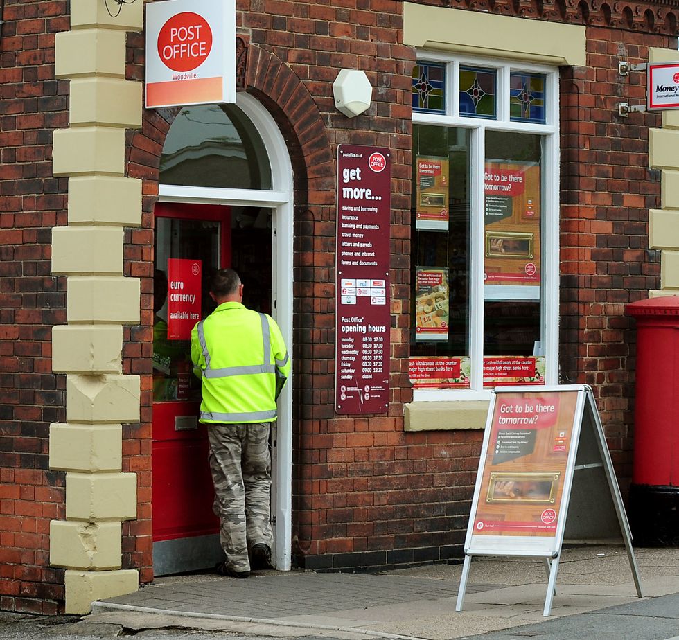 EMBARGOED TO 0001 MONDAY SEPTEMBER 26 File photo dated 21/05/13 of a Post Office in Woodville, Derbyshire. The Post Office is preparing for a %22last moment%22 rush in customers depositing paper 20 and 50 banknotes in its branches this week, before they can no longer be used in shops or to pay businesses. Issue date: Monday September 26, 2022.