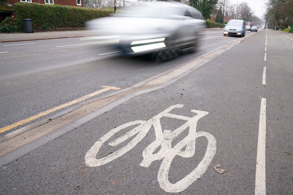 Embargoed to 0001 Saturday January 29 File photo dated 25/01/22 of traffic passing a cycle lane as a major revamp of the Highway Code to boost protection for cyclists and pedestrians comes into force on Saturday amid concern that millions of drivers are unaware of the changes. Issue date: Saturday January 29, 2022.