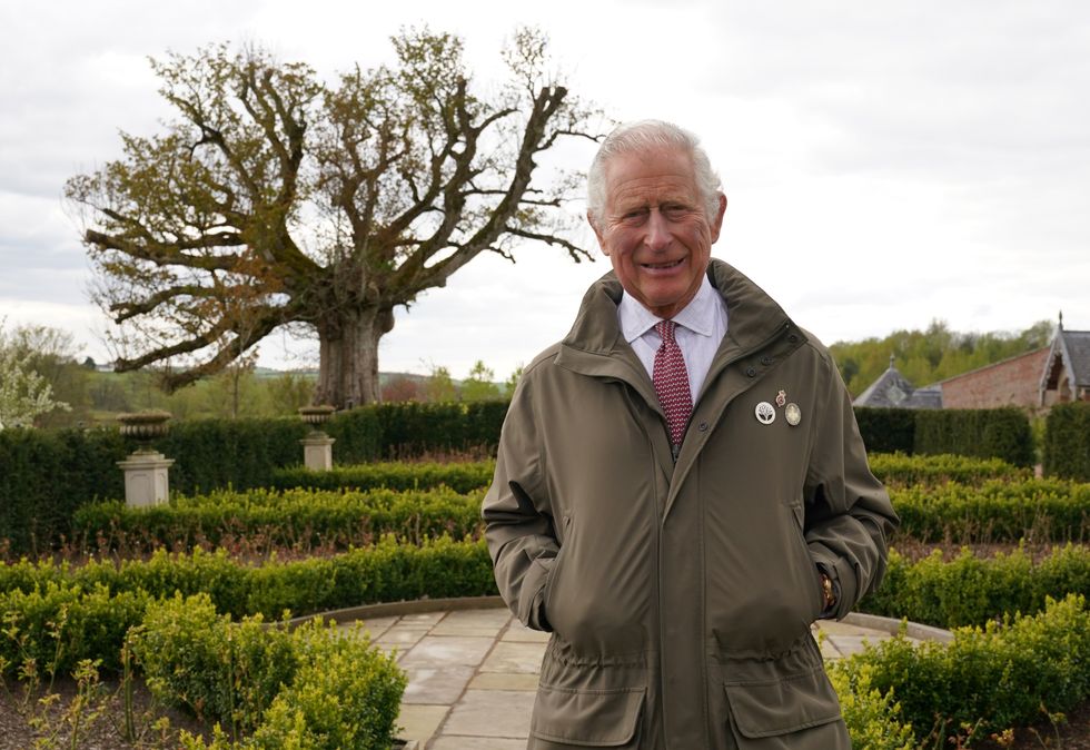 EMBARGOED TO 0001 SUNDAY MAY 1 The Prince of Wales, Patron of The Queen's Green Canopy (QGC), stands beside the 'Old Sycamore' in the Dumfries House garden, as he unveils a nationwide network of seventy ancient woodlands and seventy ancient trees, including the sycamore, to be dedicated to his mother, Queen Elizabeth II, in celebration of the Platinum Jubilee. Picture date: Monday April 25, 2022.