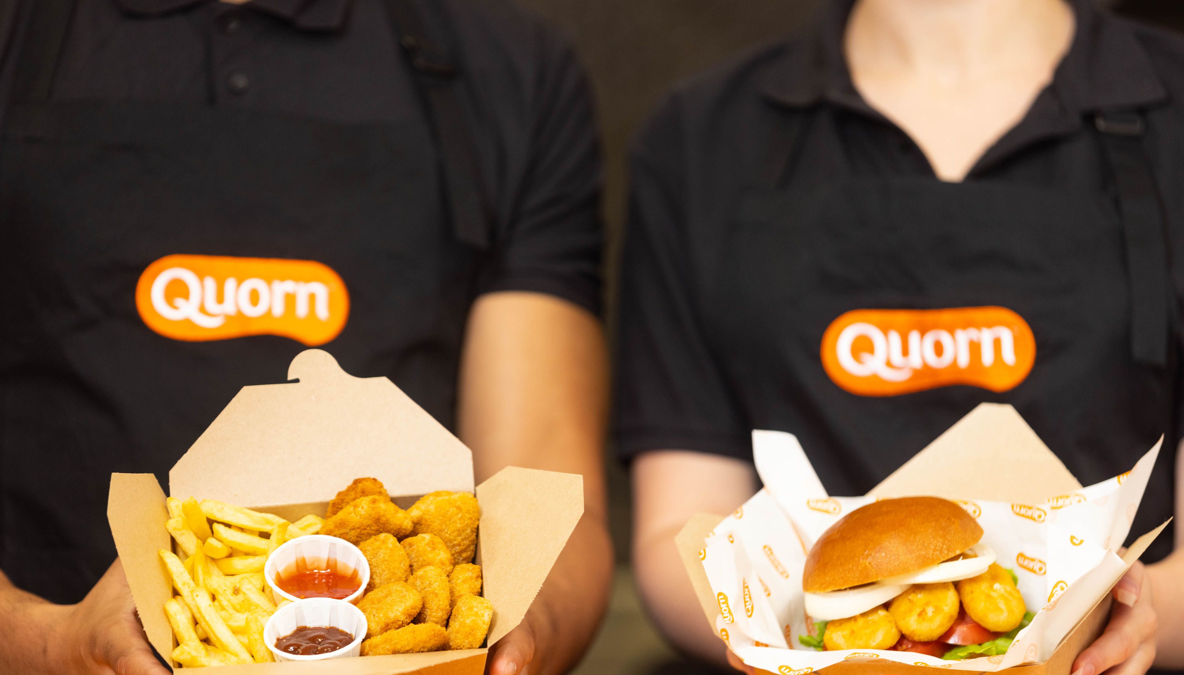 EMBARGOED TO 0001 THURSDAY SEPTEMBER 23 EDITORIAL USE ONLY Zain Nutley-Stamford and Kate Egerton-King serving at Quorn's new 'SmugNuggs' pop-up, the UK's first meat-free 'chicken' nugget restaurant, which will be open to the public from Thursday to Saturday September 25, in Camden, London. Picture date: Wednesday September 22, 2021.
