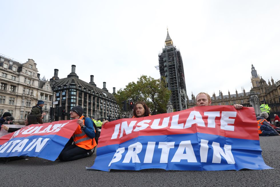 EMBARGOED TO 0001 WEDNESDAY DECEMBER 29 File photo dated 4/11/2021 of protesters from Insulate Britain block Great George Street in Parliament Square, central London. Policing Insulate Britains road-blocking protests cost taxpayers at least 4.3 million, an investigation has found. Transport Secretary Grant Shapps said he was %22appalled%22 by the bill, which was disclosed by police forces in response to Freedom of Information requests by the PA news agency. Issue date: Wednesday December 29, 2021.