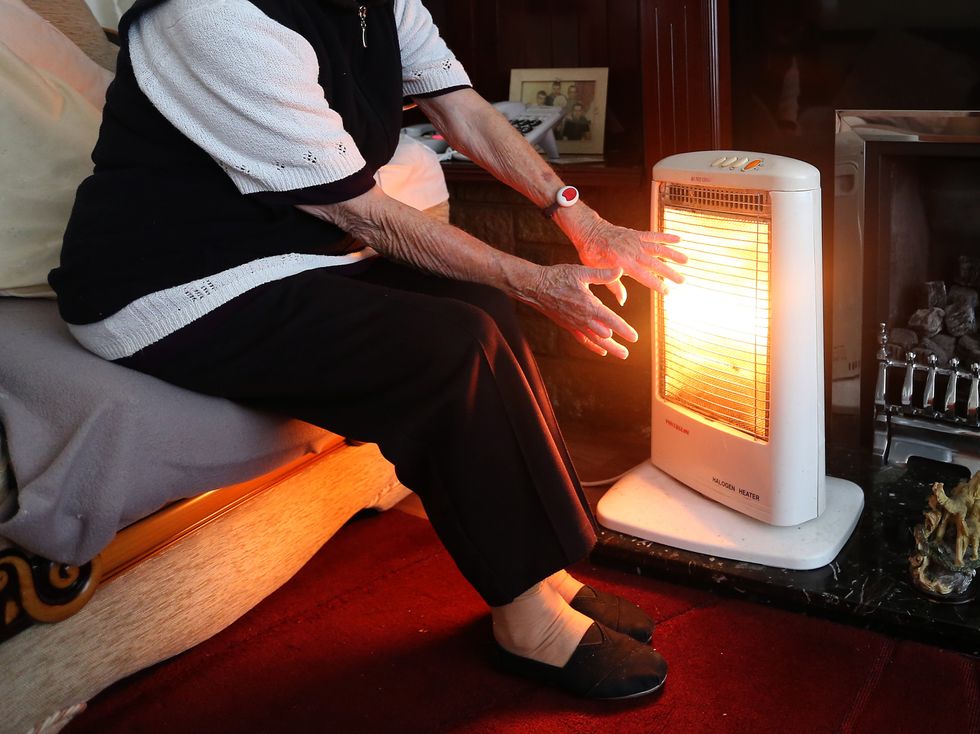 EMBARGOED TO 0001 WEDNESDAY MARCH 23 File photo dated 19/11/14 of a stock photo of an elderly lady with her electric fire on at home. A fifth of older households who are ineligible for the council tax rebate to offset energy price rises are already living in poverty or hardship, a charity has warned. Issue date: Wednesday March 23, 2022.