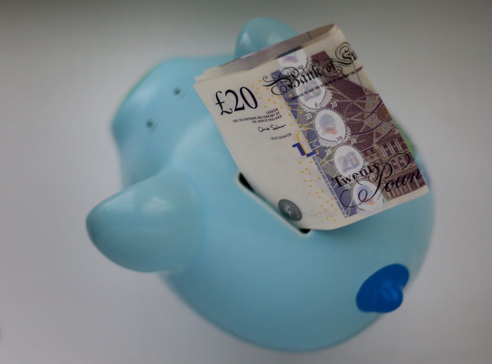 EMBARGOED TO 0001 WEDNESDAY NOVEMBER 30 File photo dated 06/01/15 of money in a piggy bank, as more people with excess savings held in cash could be encouraged to move their money into stocks and shares Isas, as a result of proposals to make financial advice easier to access.