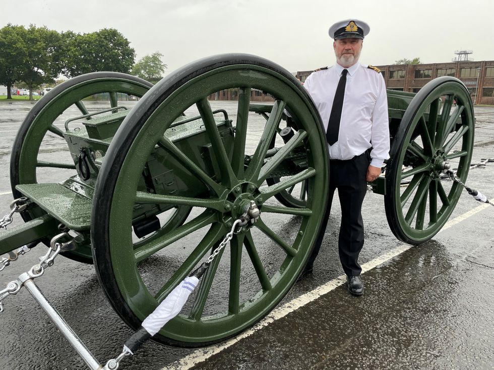 EMBARGOED TO 1300 THURSDAY SEPTEMBER 15 Lieutenant Commander Paul 'Ronnie' Barker standing next to the gun carriage that is going to be used to carry Queen Elizabeth II's coffin during the funeral procession, while being towed by the Royal Navy sailors. Picture date: Wednesday September 14, 2022.