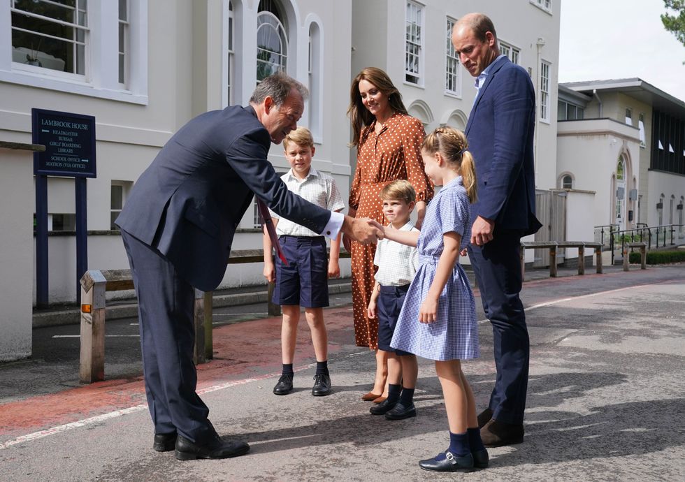EMBARGOED TO 2230 BST WEDNESDAY SEPTEMBER 7 Prince George, Princess Charlotte and Prince Louis, accompanied by their parents the Duke and Duchess of Cambridge, are greeted by Headmaster Jonathan Perry as they arrive for a settling in afternoon at Lambrook School, near Ascot in Berkshire. The settling in afternoon is an annual event held to welcome new starters and their families to Lambrook and takes place the day before the start of the new school term. Picture date: Wednesday September 7, 2022.