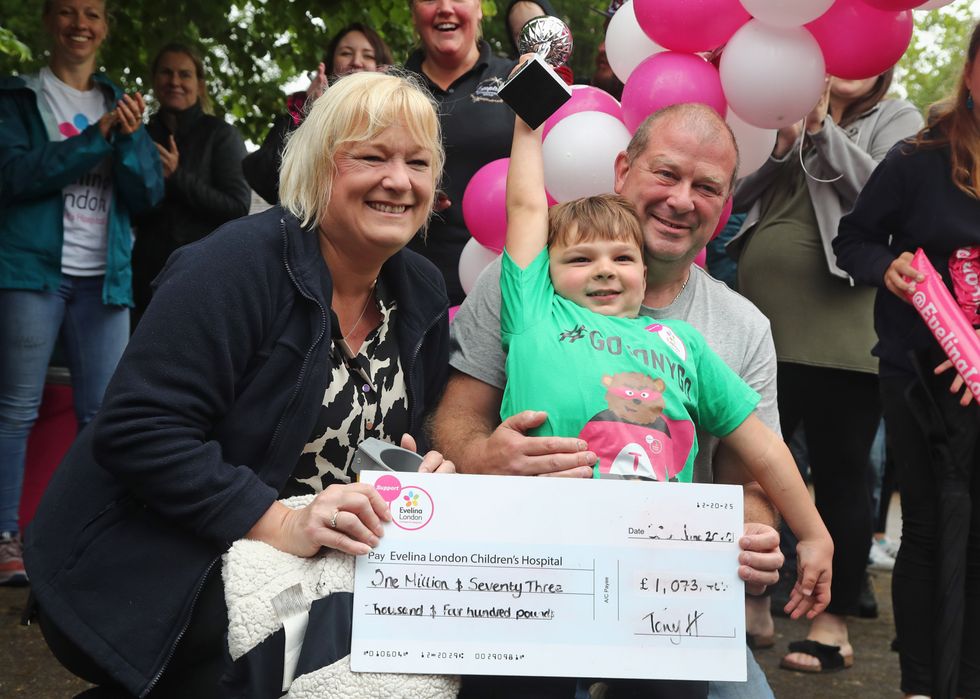 EMBARGOED TO 2230 SATURDAY AUGUST 27 File photo dated 30/06/2020 of Tony Hudgell, who uses prosthetic legs, celebrating after taking the final steps in his fundraising walk in West Malling Kent with mum, Paula and dad Mark. Paula Hudgell the adoptive mother of the little boy tortured by his birth parents, has welcomed a move to stop the release of his father from prison. Issue date: Saturday August 27, 2022.