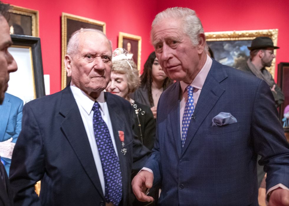 EMBARGOED TO 2230 WEDNESDAY JANUARY 26 The Prince of Wales meets Holocaust survivor Arek Hersh as he attends an exhibition at The Queen's Gallery, Buckingham Palace, London, of 'Seven Portraits: Surviving the Holocaust', which were commissioned by the prince to pay tribute to Holocaust survivors. Picture date: Monday January 24, 2022.