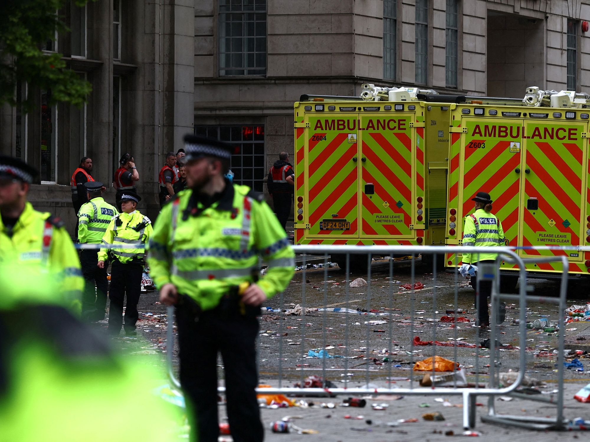 Emergency services at an incident involving a car and supporters
