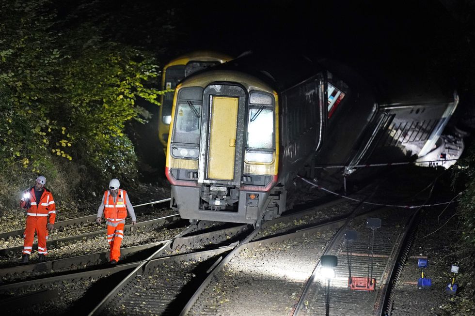 Emergency services at the scene of a crash involving two trains near the Fisherton Tunnel between Andover and Salisbury in Wiltshire. Fifty firefighters are at the scene of the collision in which up to a dozen passengers are believed to have been injured. Picture date: Monday November 1, 2021.
