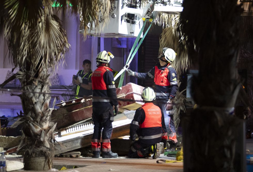 Emergency staff's members work after a two-storey restaurant collapsed