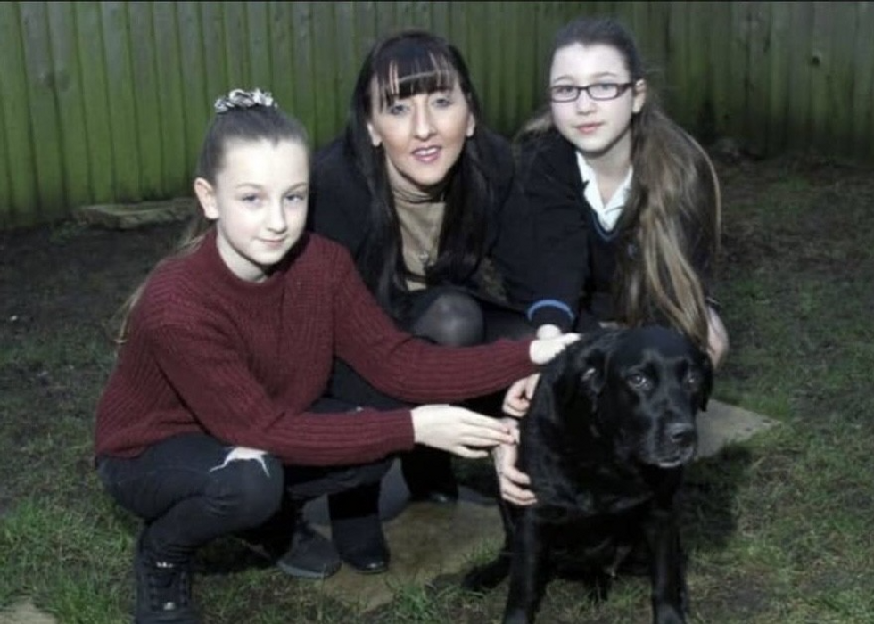 Emma and her daughters with their dog, Jess