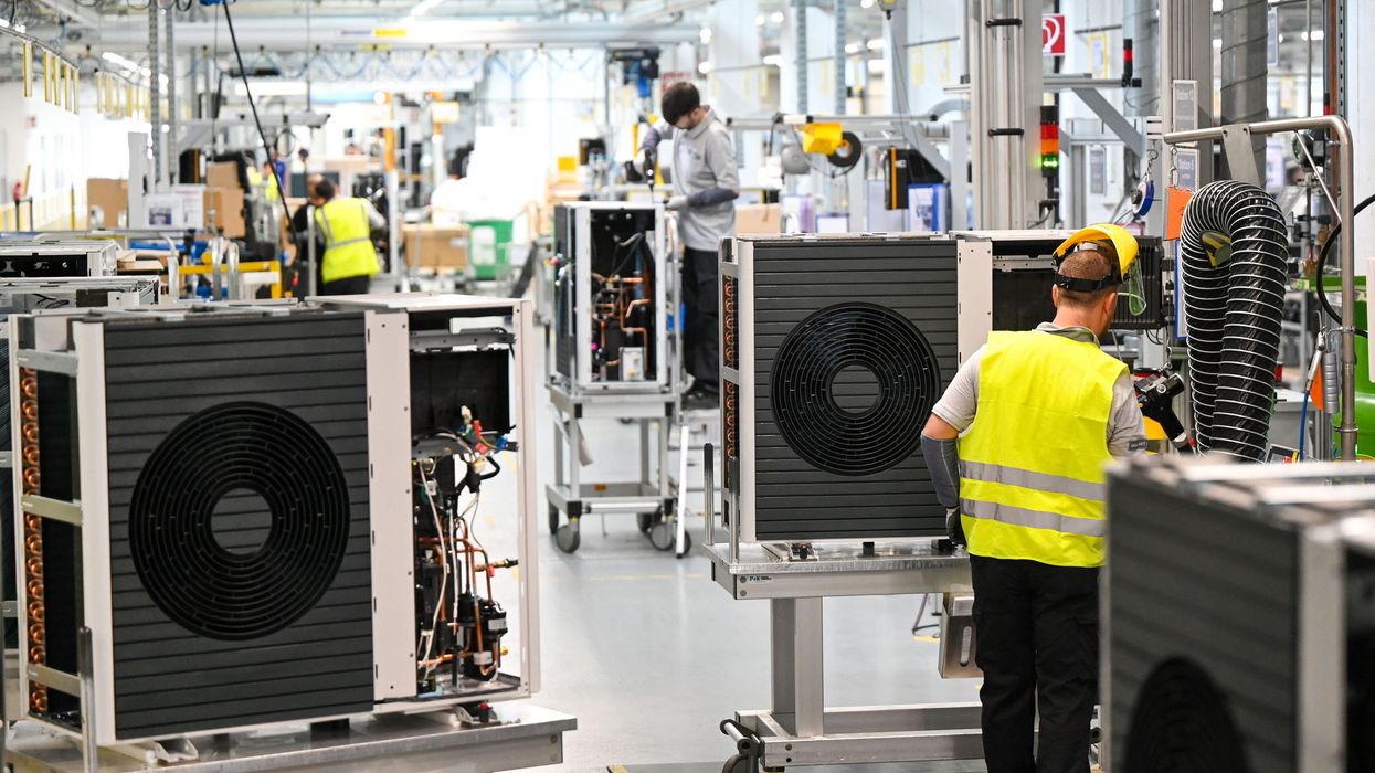 Employees assemble air-to-water heat pumps in Germany