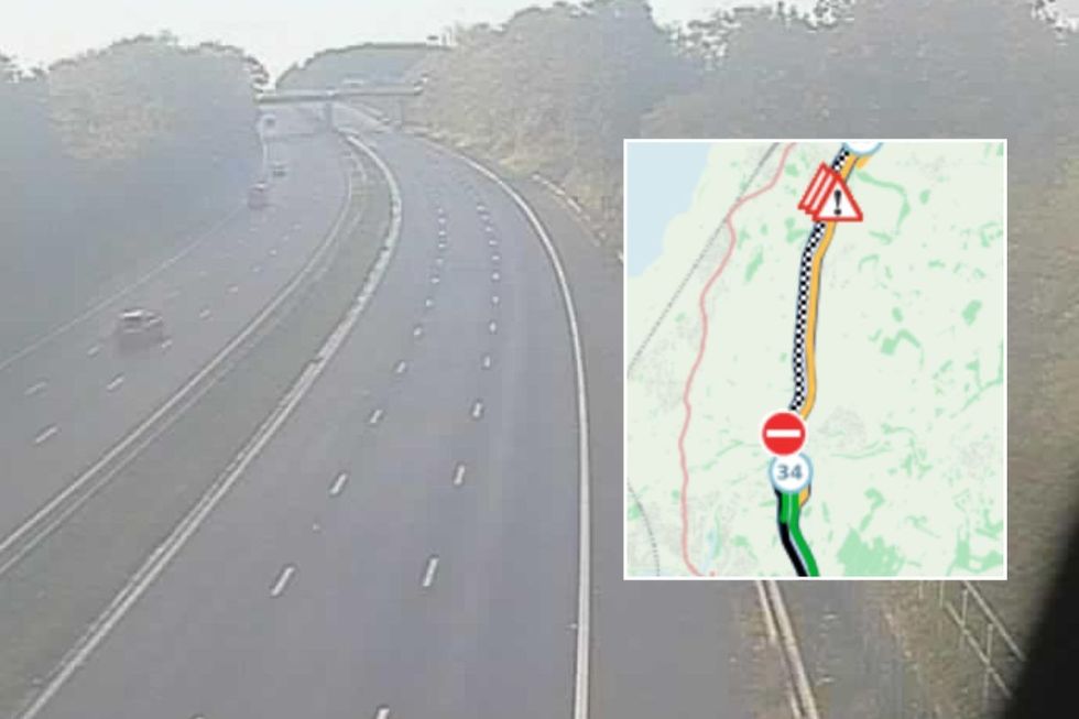Empty M6 motorway and a closed road sign