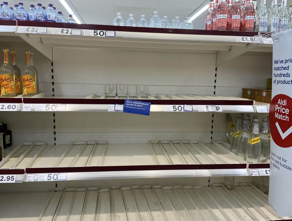 Empty shelves in the drinks section of a branch of Tesco in Liverpool.
