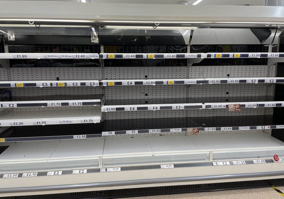 Empty shelves in the meat aisle of a branch of Tesco in Liverpool.