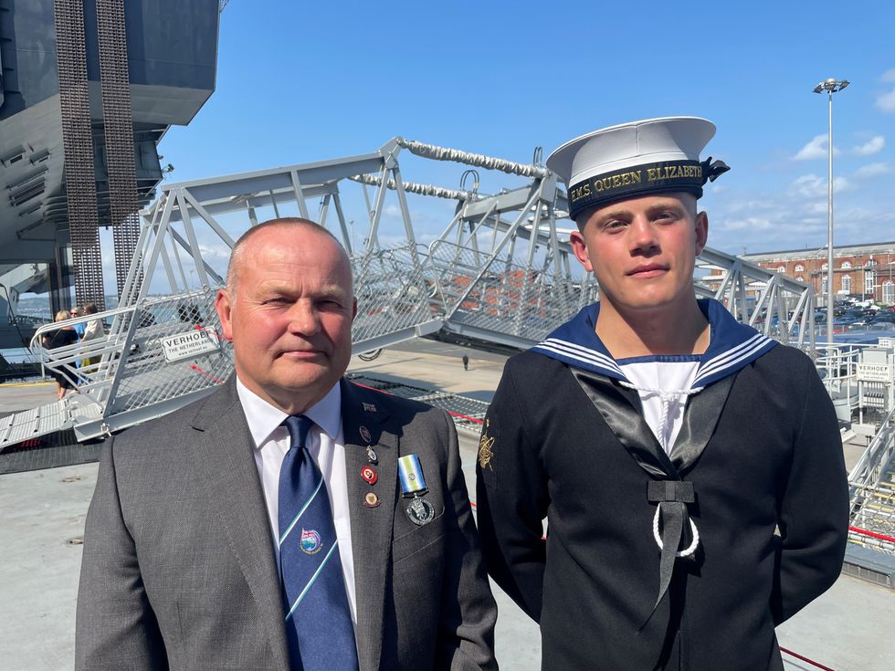 Engineering technician (weapons engineering) Lewis Merckel, 20, whose first ship in the navy is the HMS Queen Elizabeth, attended the reception with his father Martyn, 60, who served as an able seaman aboard HMS Yarmouth during the Falklands conflict. Picture date: Wednesday July 20, 2022.
