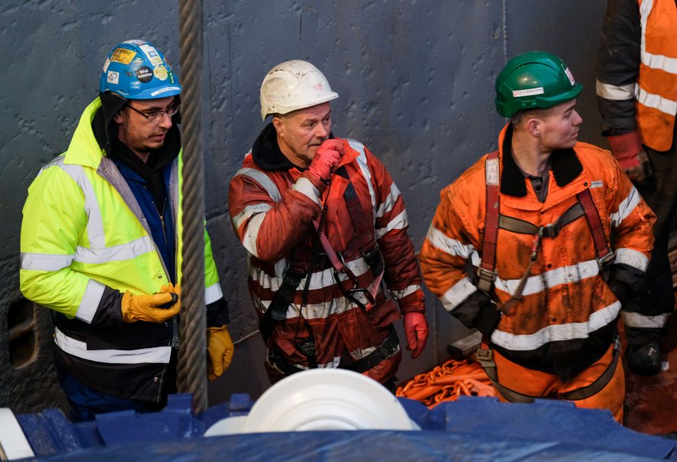 Engineers oversee the unloading of the Sirius Minerals Tunnel Boring Machine after it arrives by ship from Rotterdam at the AV Dawson logistics site on the banks of the River Tees