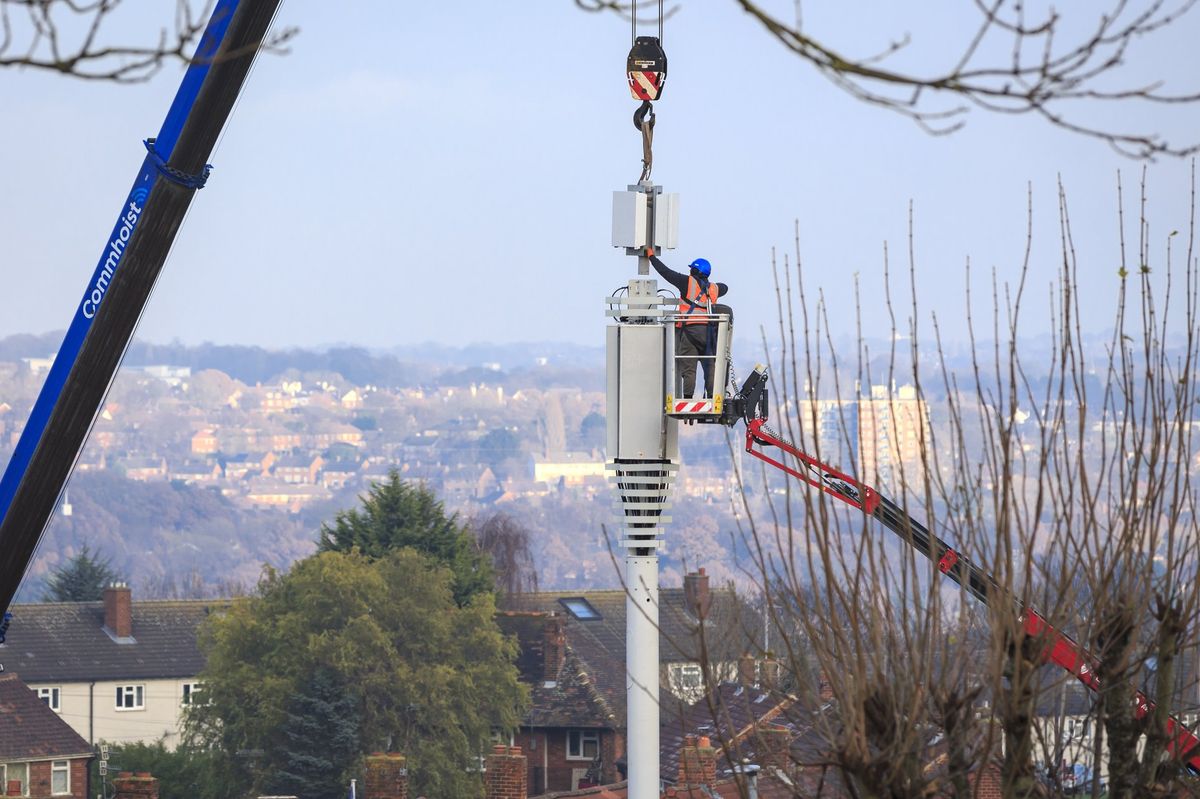 Engineers set-up a mobile network mast on the outskirts of Leeds