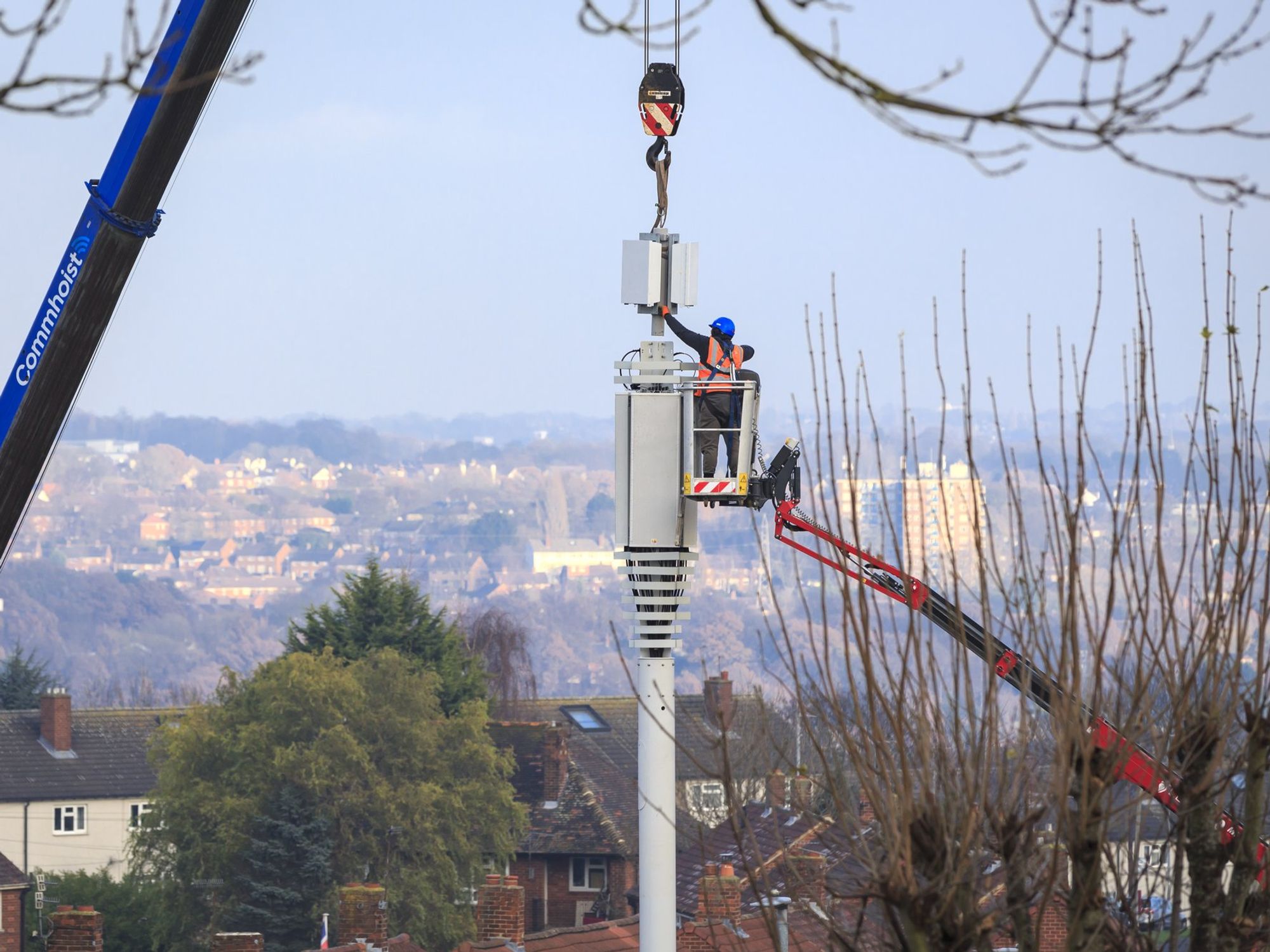 Engineers set-up a mobile network mast on the outskirts of Leeds