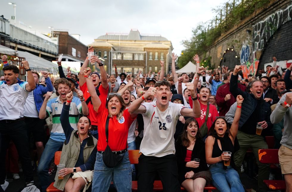 England fans celebrate as Kane tucks away his penalty