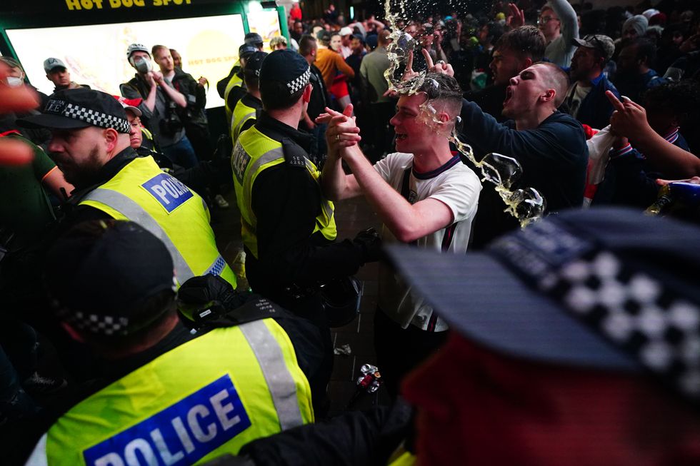 England fans clash with police in Piccadilly Circus, London, after Italy beat England on penalties to win the UEFA Euro 2020 Final