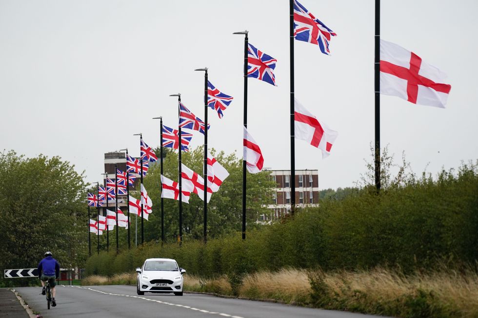 England flags and Union Jacks tied to street posts