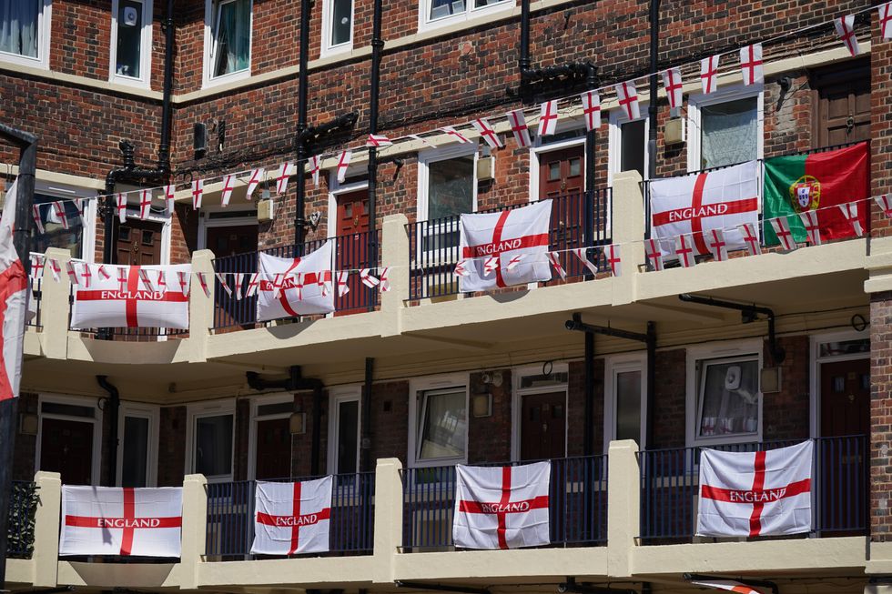 England flags put up on the Kirby Estate in Bermondsey, south London, where residents are showing their support for England ahead of the nation's first Euros 2020 match on Sunday. Picture date: Wednesday June 9, 2021.