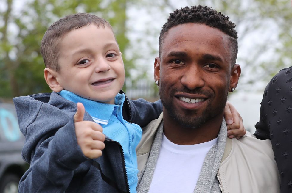 England footballer Jermain Defoe with Bradley Lowery, as he celebrates his sixth birthday at Blackhall Cricket Club near Durham.