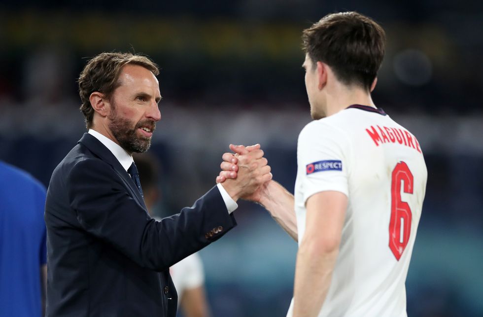 England manager Gareth Southgate shakes hands with Harry Maguire after the UEFA Euro 2020 Quarter Final match at the Stadio Olimpico, Rome. Picture date: Saturday July 3, 2021.