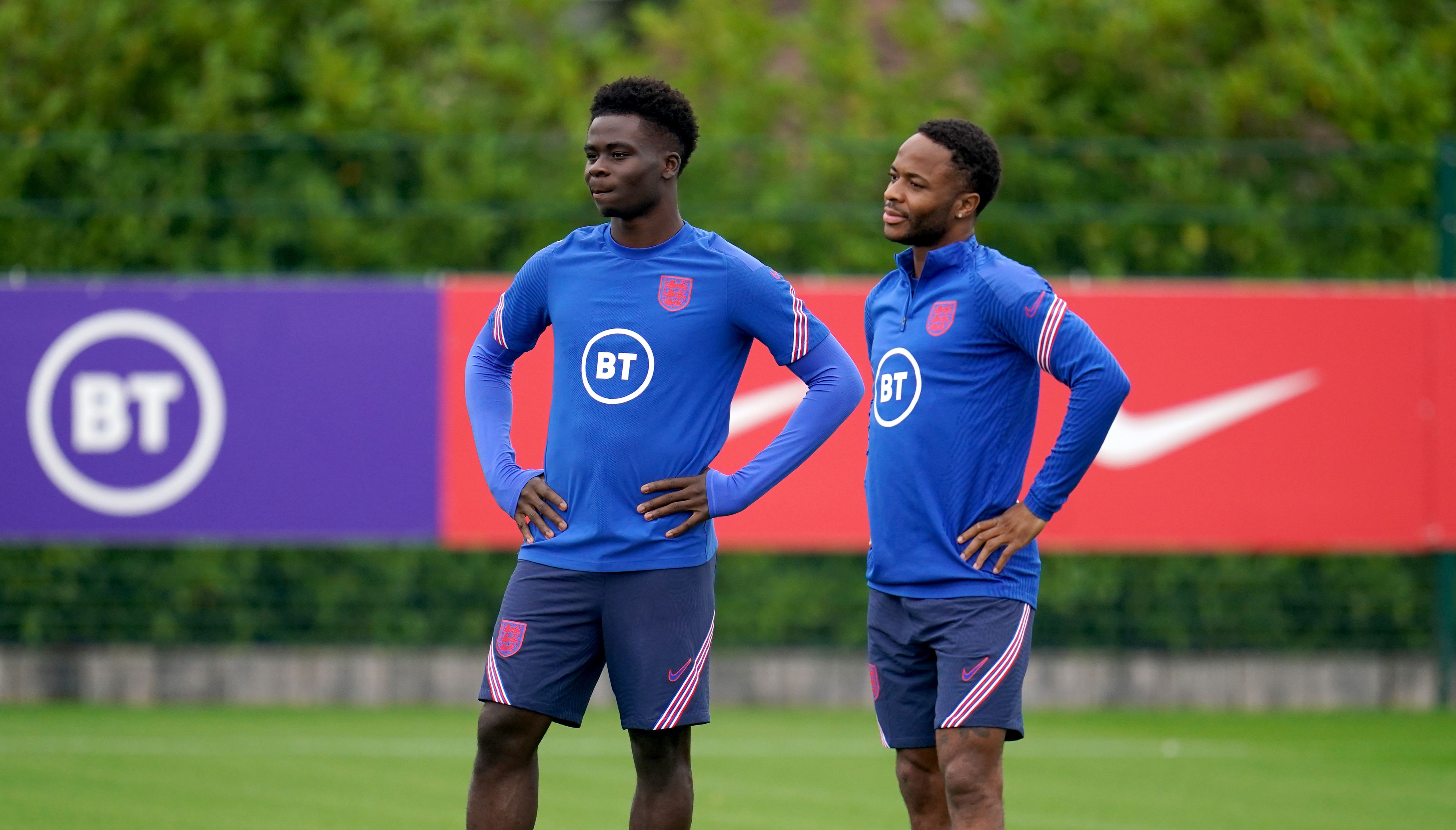 England's Bukayo Saka (left) and Raheem Sterling during a training session at the Hotspur Way Training Ground, London.