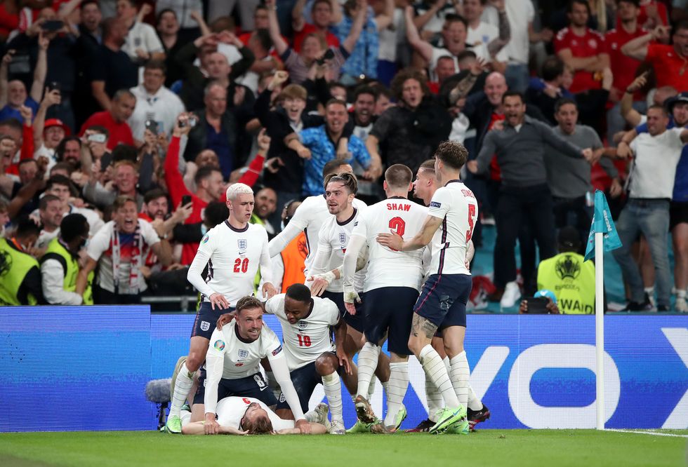 England's Harry Kane is mobbed by team-mates after scoring their side's second goal of the game in extra-time during the UEFA Euro 2020 semi final match at Wembley Stadium