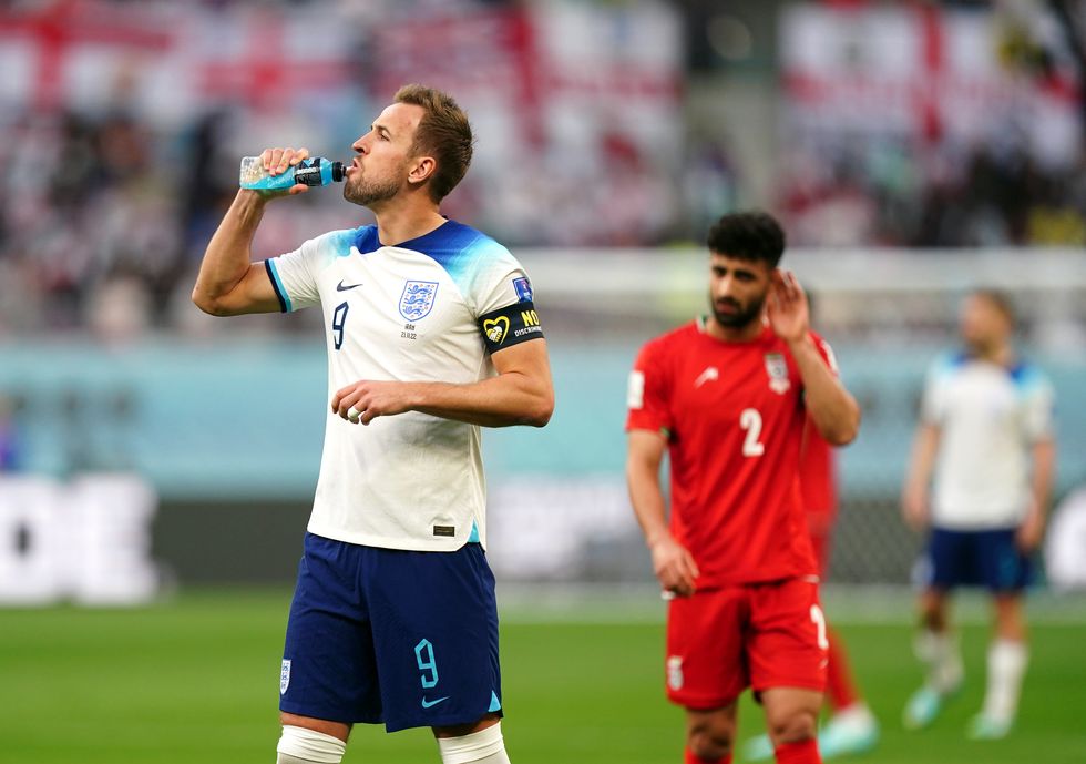 England's Harry Kane takes a drink during the FIFA World Cup Group B match at the Khalifa International Stadium, Doha. Picture date: Monday November 21, 2022.