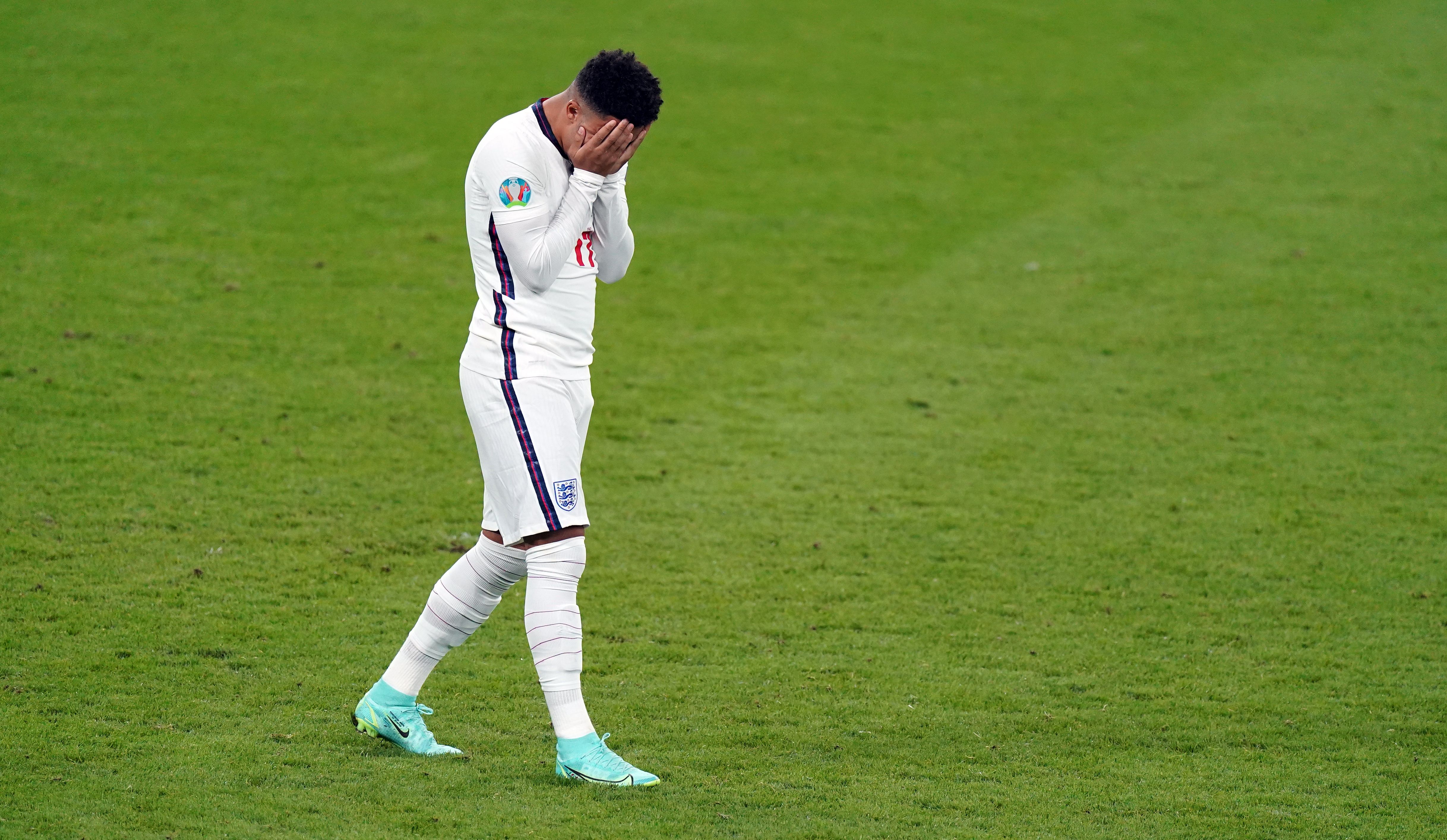 England's Jadon Sancho stands dejected after missing from the penalty spot during the penalty shoot out following the UEFA Euro 2020 Final at Wembley.