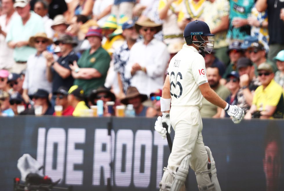 England's Joe Root walks off after being dismissed during day one of the first Ashes test at The Gabba, Brisbane.