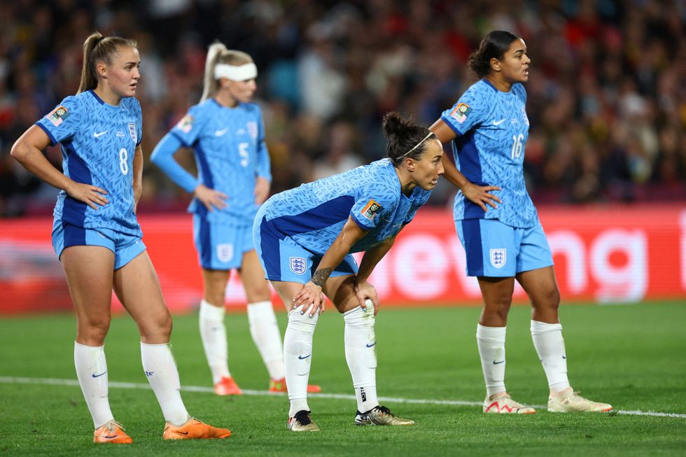 England's Lucy Bronze, Georgia Stanway and Jess Carter look on