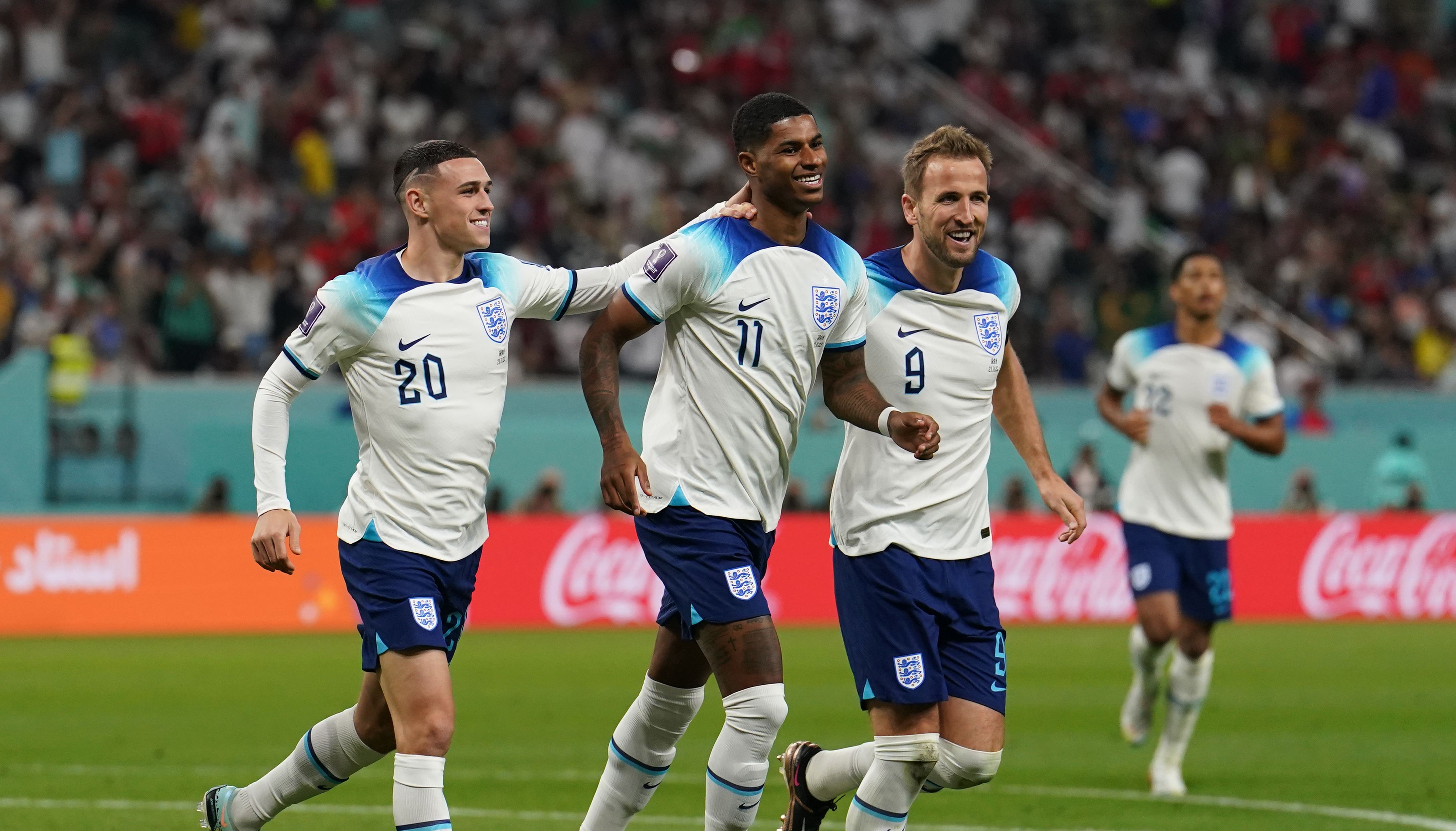 England's Marcus Rashford (centre) celebrates with Phil Foden (left) and Harry Kane after scoring their side's fifth goal of the game during the FIFA World Cup Group B match at the Khalifa International Stadium in Doha, Qatar. Picture date: Monday November 21, 2022.