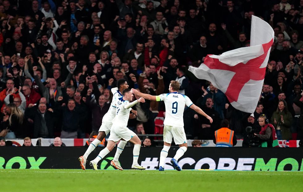England's Marcus Rashford (left) celebrates scoring their side's second goal of the game with team-mates Phil Foden and Harry Kane